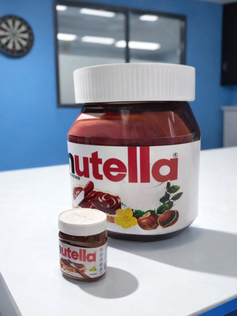 Oversized Nutella jar replica beside a real jar for scale